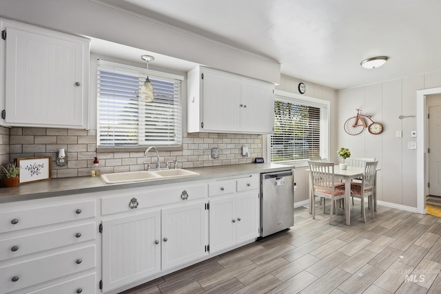 827 Alturas Dr N, Twin Falls, ID 83301 - kitchen featuring backsplash, dishwasher, white cabinetry, and a sink