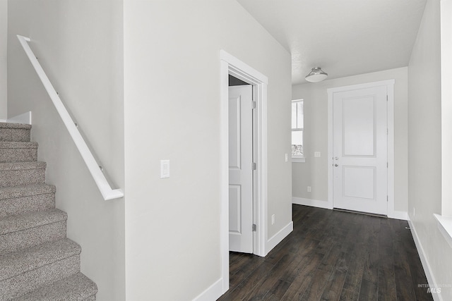 stairway with baseboards and wood finished floors