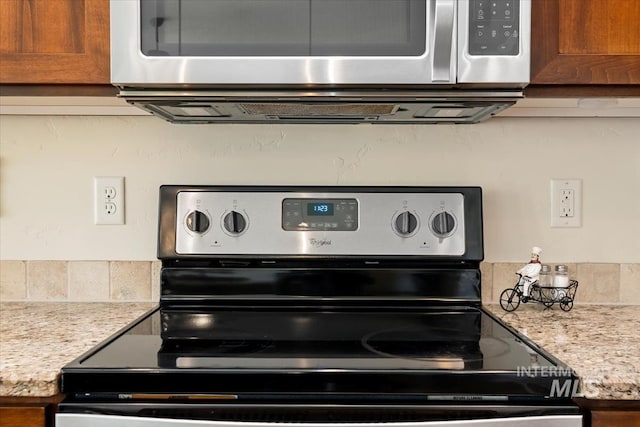 interior details featuring stainless steel appliances and brown cabinets