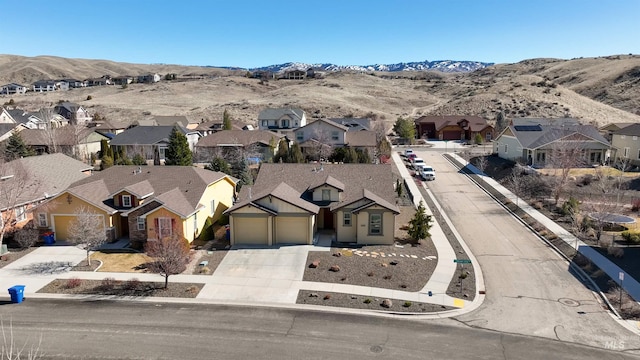 aerial view featuring a mountain view and a residential view