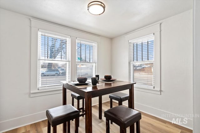 dining space featuring light hardwood / wood-style flooring