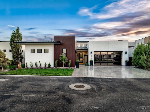 view of front of property with driveway and an attached garage