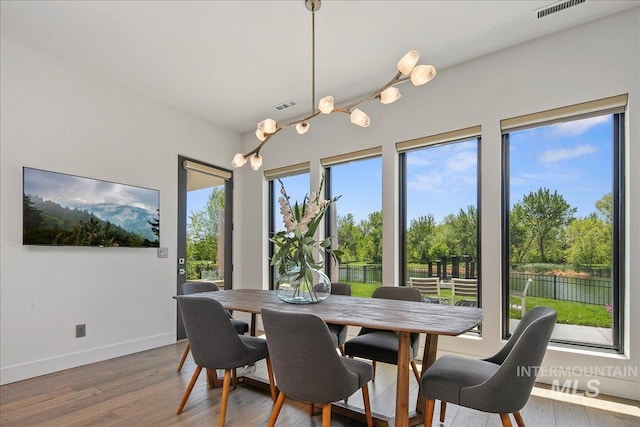 dining room with wood finished floors and baseboards