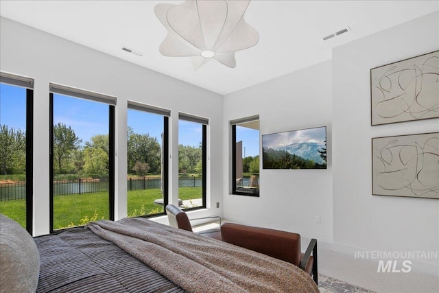 bedroom with a ceiling fan and baseboards