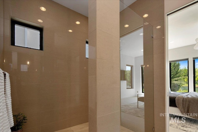 full bath featuring ensuite bathroom, recessed lighting, and a walk in shower