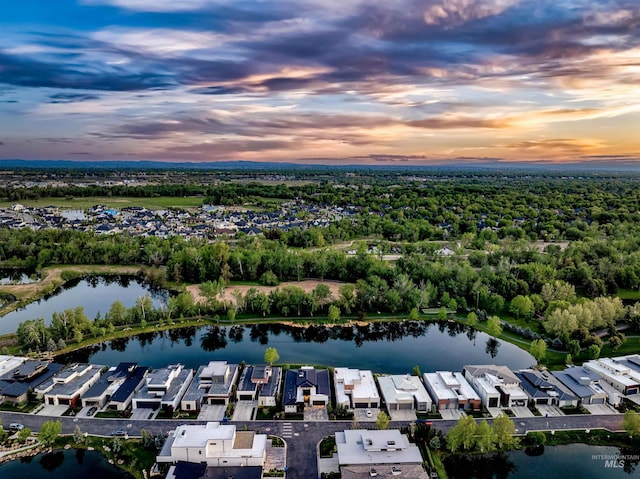 aerial view at dusk of a residential view and a water view