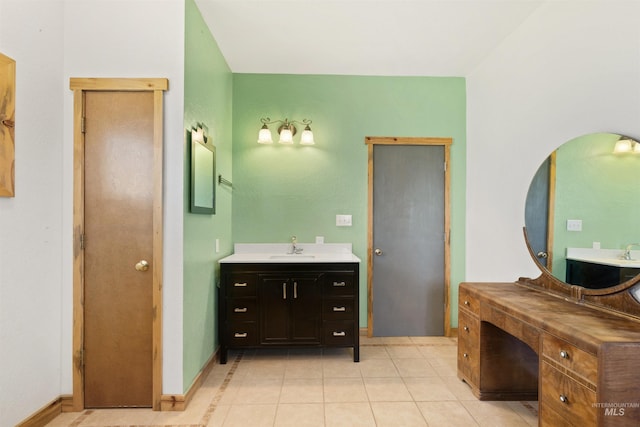 bathroom with tile floors, double sink, and large vanity