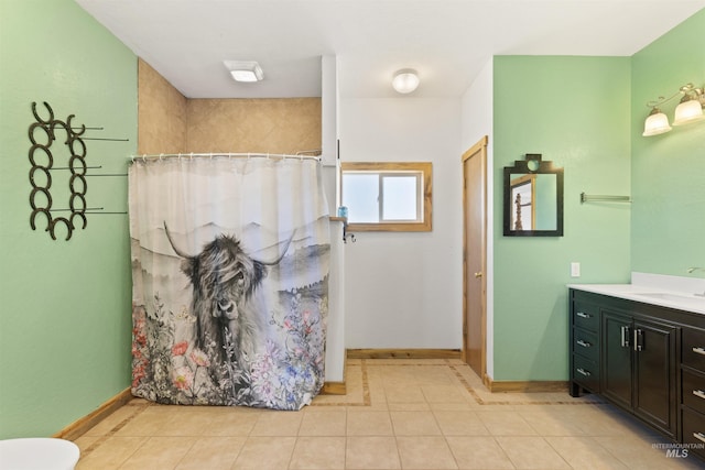 bathroom with tile flooring and vanity