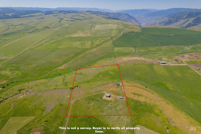 aerial view featuring a rural view and a mountain view