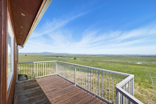 wooden terrace with a rural view