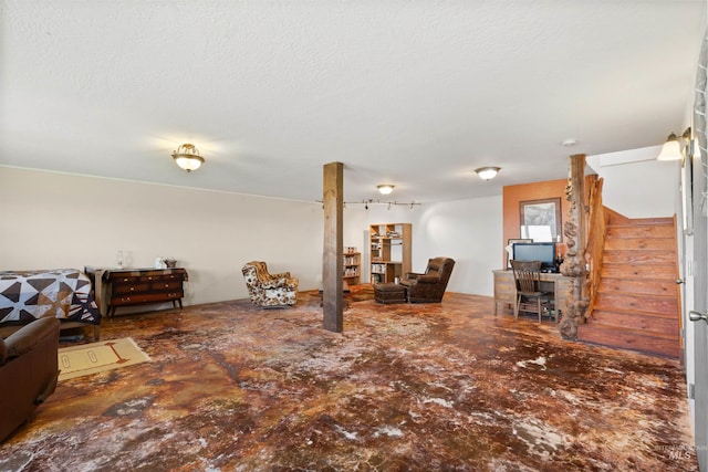 living room with a textured ceiling