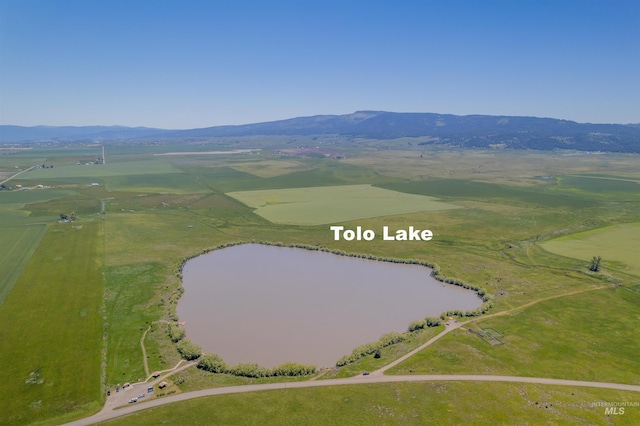 drone / aerial view with a rural view and a water and mountain view