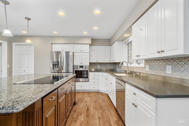2220 14th St, Lewiston, ID 83501 - kitchen featuring a sink, appliances with stainless steel finishes, light wood-style floors, white cabinetry, and recessed lighting