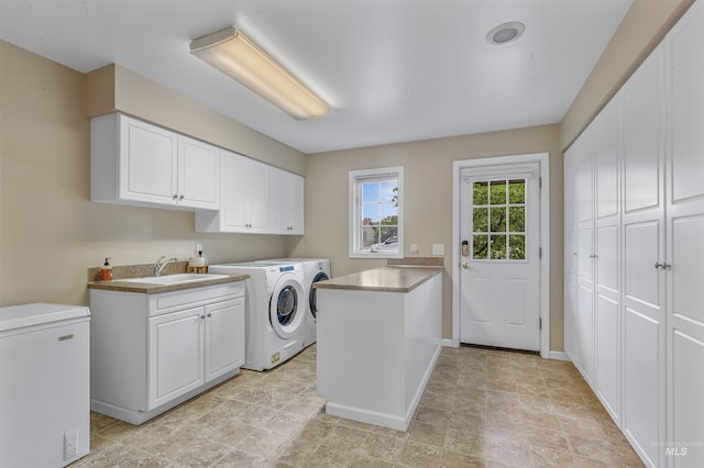 2220 14th St, Lewiston, ID 83501 - washroom featuring washing machine and clothes dryer, cabinet space, and baseboards