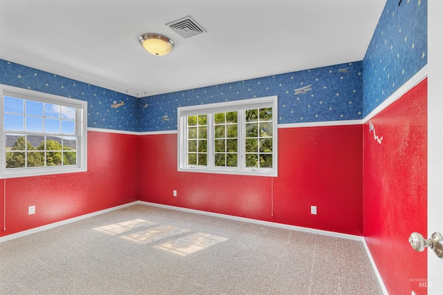 2220 14th St, Lewiston, ID 83501 - carpeted empty room featuring plenty of natural light, wallpapered walls, and baseboards