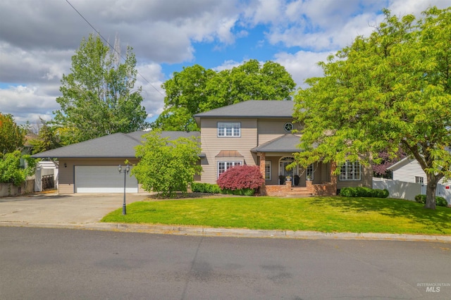 2220 14th St, Lewiston, ID 83501 - view of front facade with concrete driveway, an attached garage, and covered porch