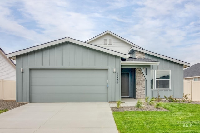 7343 E Marble Springs Dr, Nampa, ID 83687 - ranch-style house featuring board and batten siding, an attached garage, and driveway