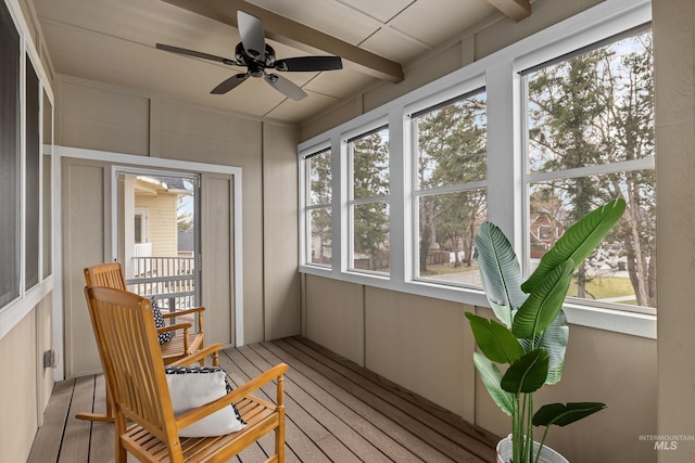 sunroom / solarium with a ceiling fan