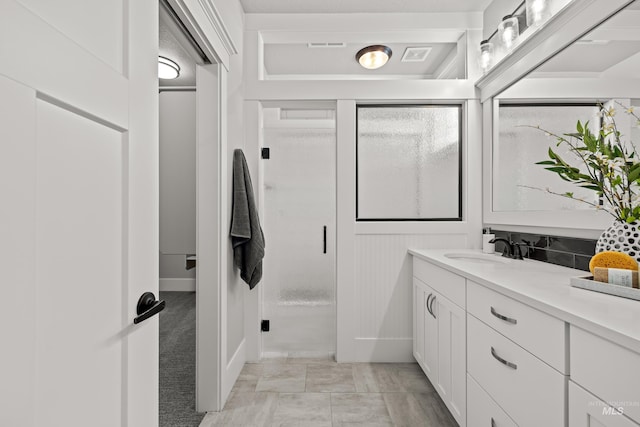 bathroom with visible vents and vanity