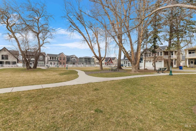 exterior space with a residential view and a front yard