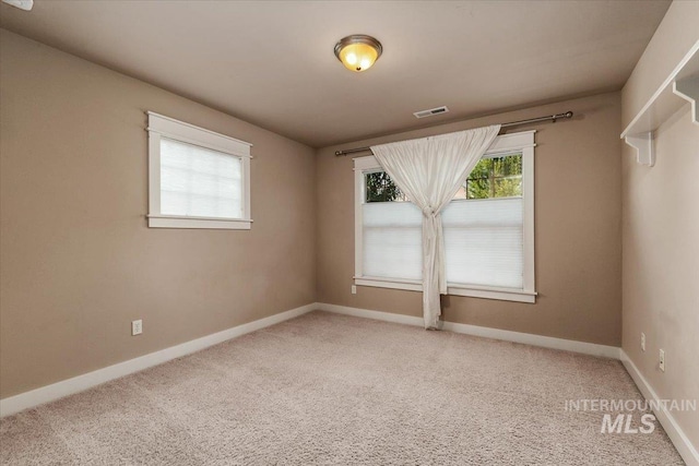 empty room featuring carpet flooring