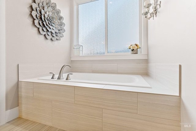 bathroom with tiled bath