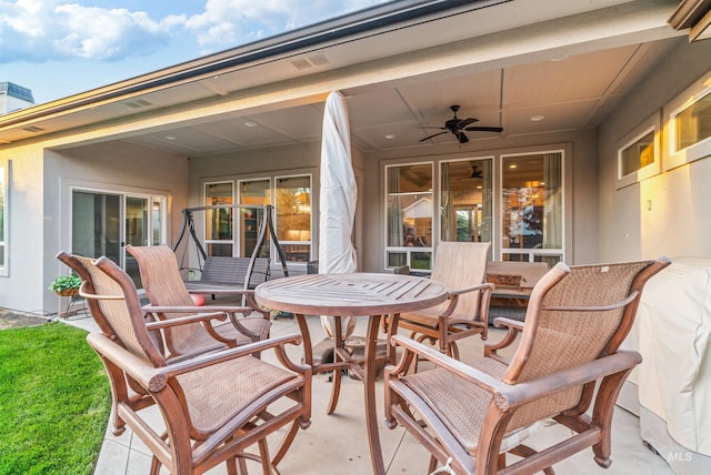 view of patio featuring ceiling fan