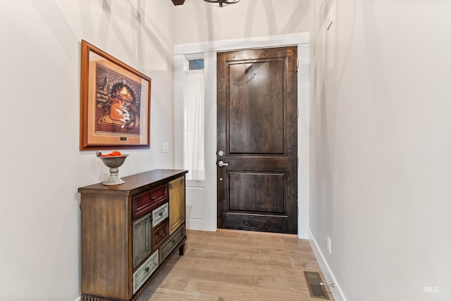 doorway to outside featuring light hardwood / wood-style floors