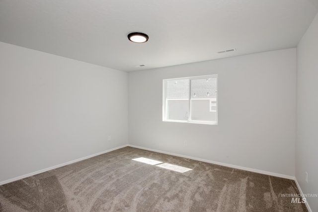 unfurnished room featuring carpet floors