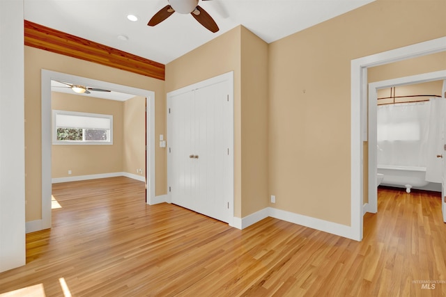 unfurnished room with ceiling fan and light hardwood / wood-style floors