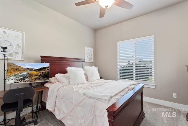 carpeted bedroom featuring ceiling fan