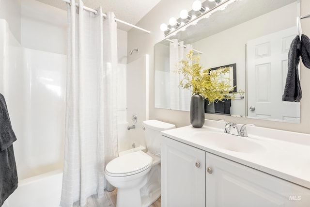 full bathroom featuring shower / bathtub combination with curtain, vanity, and toilet