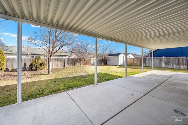 view of patio with a storage shed