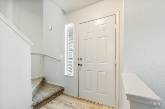 entrance foyer with light wood-type flooring