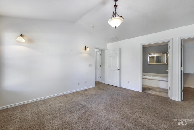 2563 Paintbrush Dr, Twin Falls, ID 83301 - unfurnished bedroom featuring carpet floors, lofted ceiling, connected bathroom, and a walk in closet