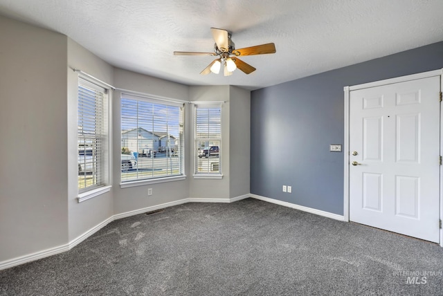 2563 Paintbrush Dr, Twin Falls, ID 83301 - unfurnished room with carpet flooring, a ceiling fan, and a textured ceiling