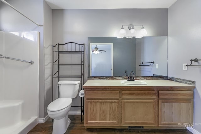 2563 Paintbrush Dr, Twin Falls, ID 83301 - full bath with a shower, a ceiling fan, vanity, and wood finished floors