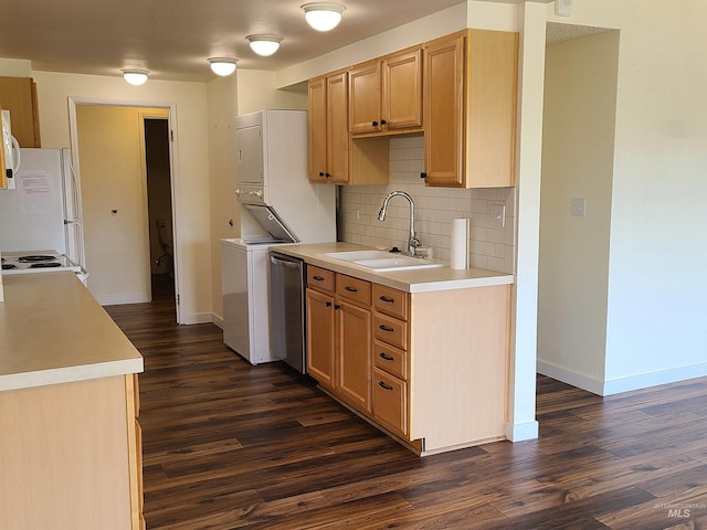 200 N 3rd Unit 401, Boise, ID 83702 - kitchen with a sink, white appliances, estacked washer and dryer, dark wood-style floors, and tasteful backsplash