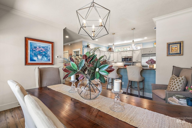 998 E Shadow Creek Ln, Eagle, ID 83616 - dining area with a chandelier, dark wood-style floors, ornamental molding, baseboards, and recessed lighting