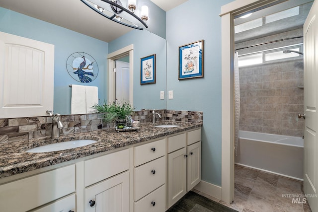 998 E Shadow Creek Ln, Eagle, ID 83616 - bathroom featuring double vanity, baseboards, and shower / bathtub combination
