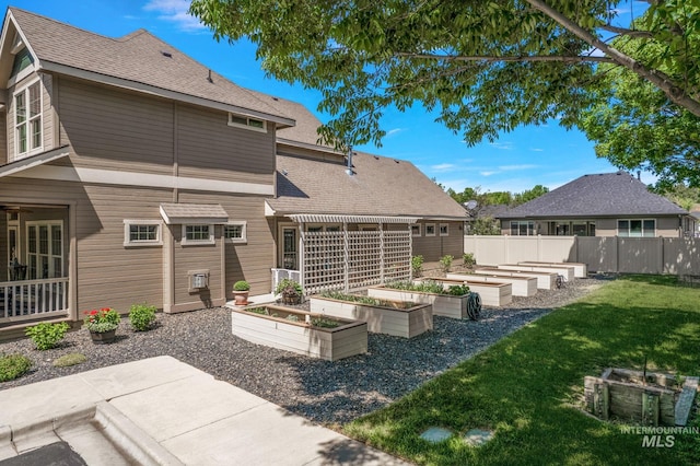 998 E Shadow Creek Ln, Eagle, ID 83616 - rear view of house with a vegetable garden, a pergola, roof with shingles, and a patio area
