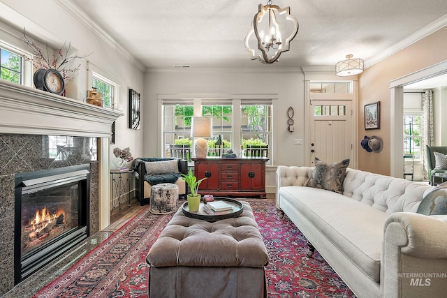 998 E Shadow Creek Ln, Eagle, ID 83616 - living area with a high end fireplace, plenty of natural light, ornamental molding, a chandelier, and wood finished floors