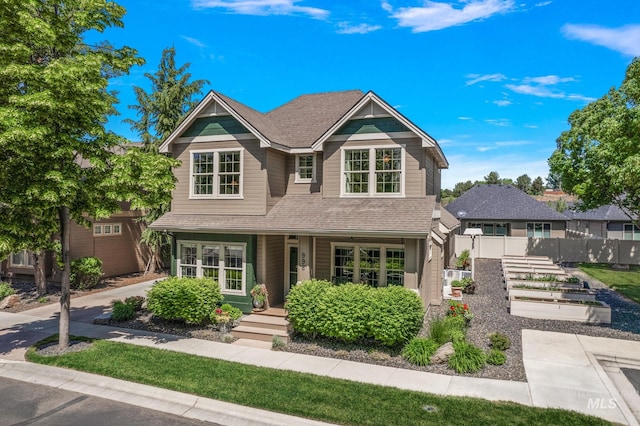998 E Shadow Creek Ln, Eagle, ID 83616 - view of front facade featuring covered porch, fence, and a shingled roof