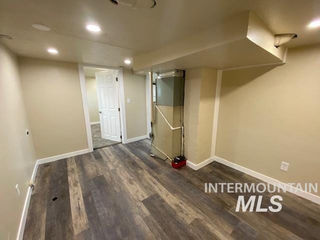 finished below grade area with wood finished floors, baseboards, and recessed lighting
