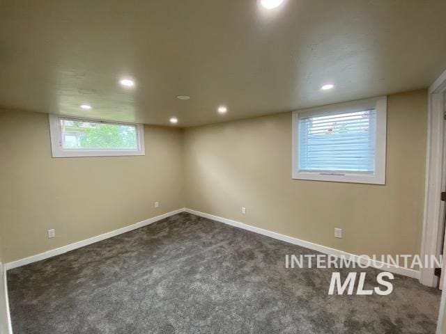below grade area with carpet floors, recessed lighting, and baseboards