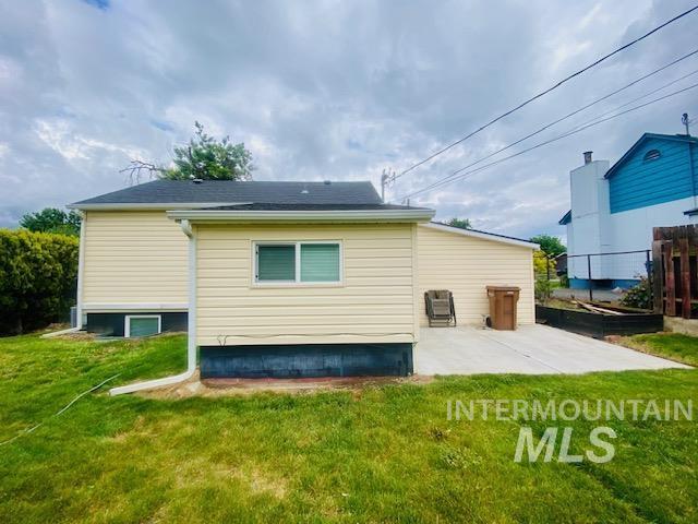 rear view of property featuring a patio