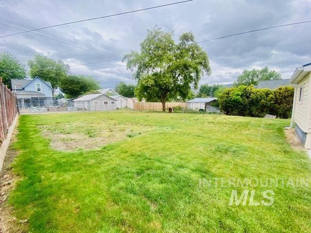 view of yard with fence
