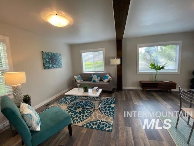 living area featuring wood finished floors and baseboards