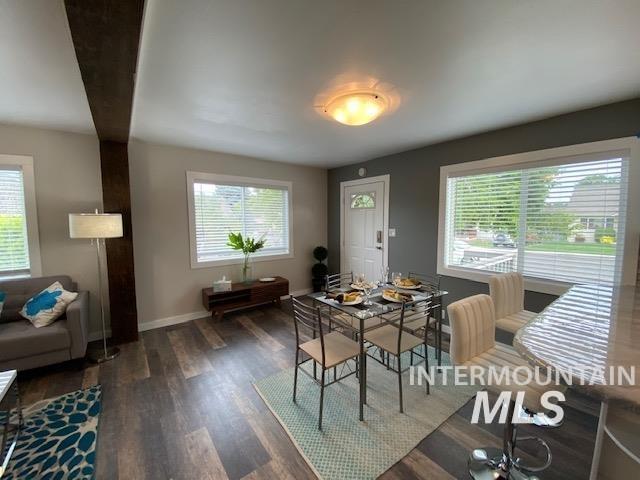 dining room with wood finished floors and baseboards