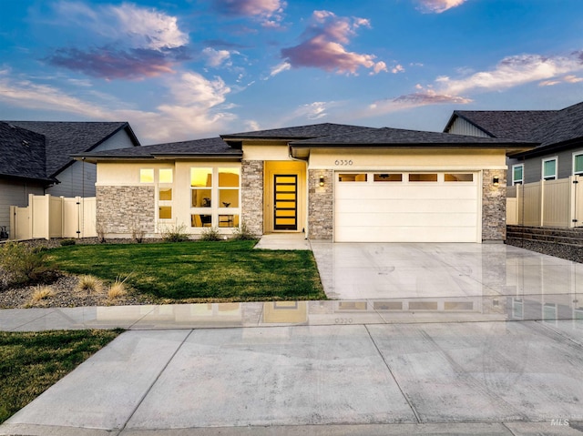 6356 S Cubola Way, Meridian, ID 83642 - view of front of home with stone siding, an attached garage, stucco siding, and driveway